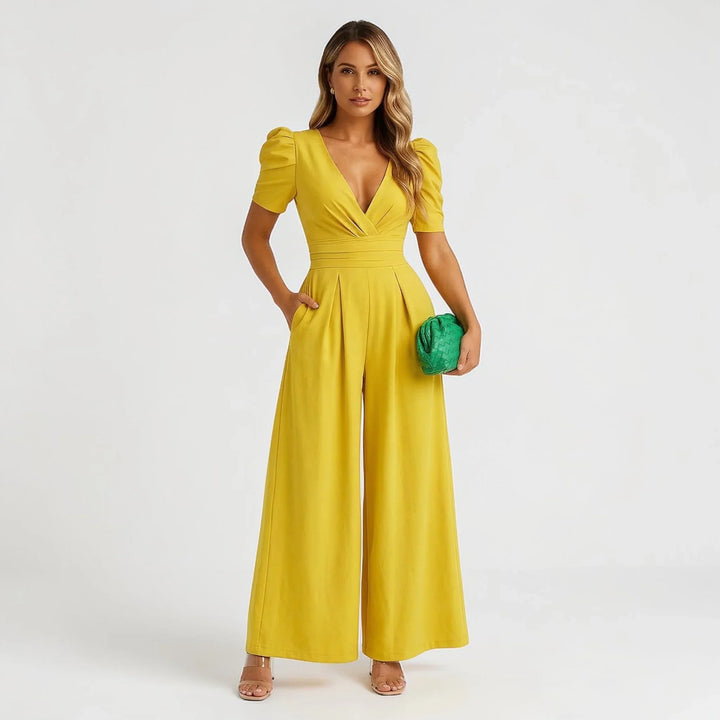 Formal women's wide leg jumpsuit with puff sleeves, an elegant and stylish option for wedding guests.