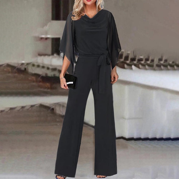 Sophisticated ladies' fashion wide leg jumpsuit with elegant draped sleeves, ideal for evening wear or versatile outfits.