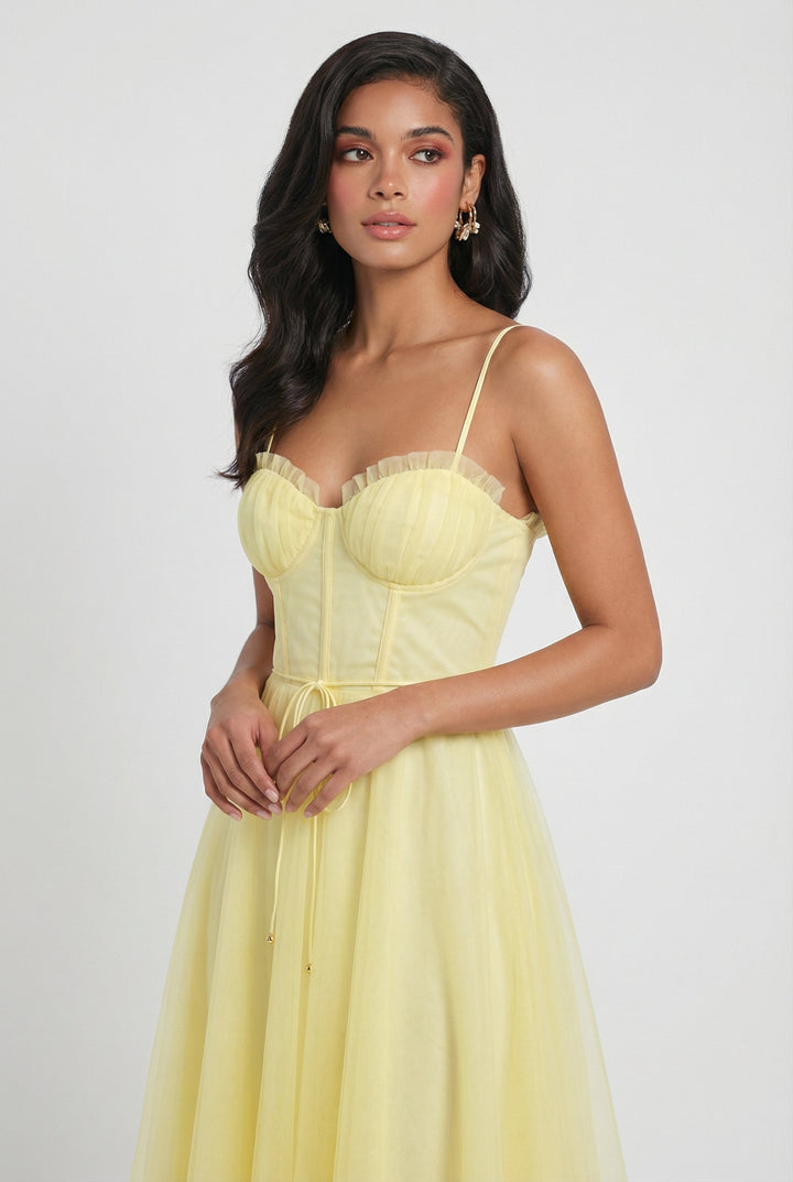 Yellow sleeveless corset midi dress for women, featuring a flattering A-line cut and chic criss-cross back.