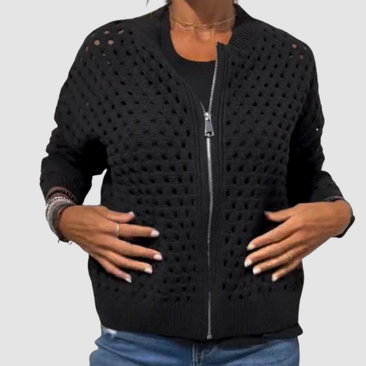 Close-up of a women's elegant zipper cardigan. Chic long sleeve top, perfect for casual or dressed-up layering.