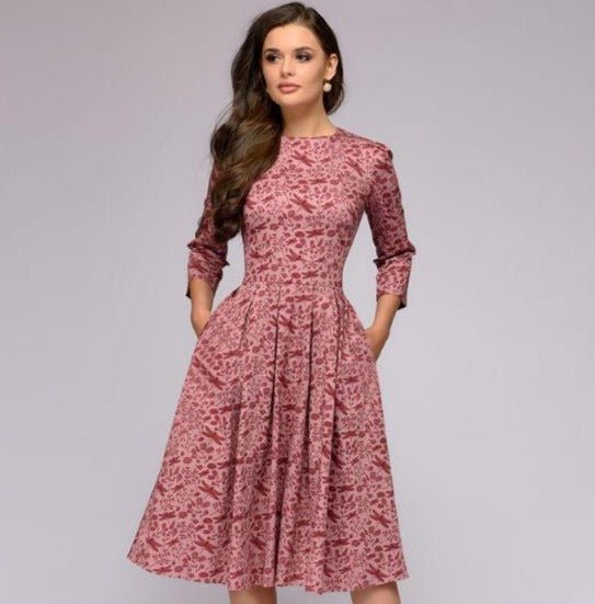 Women's A-line dress in blue-purple with floral print, 3/4 sleeves and knee-length hem.