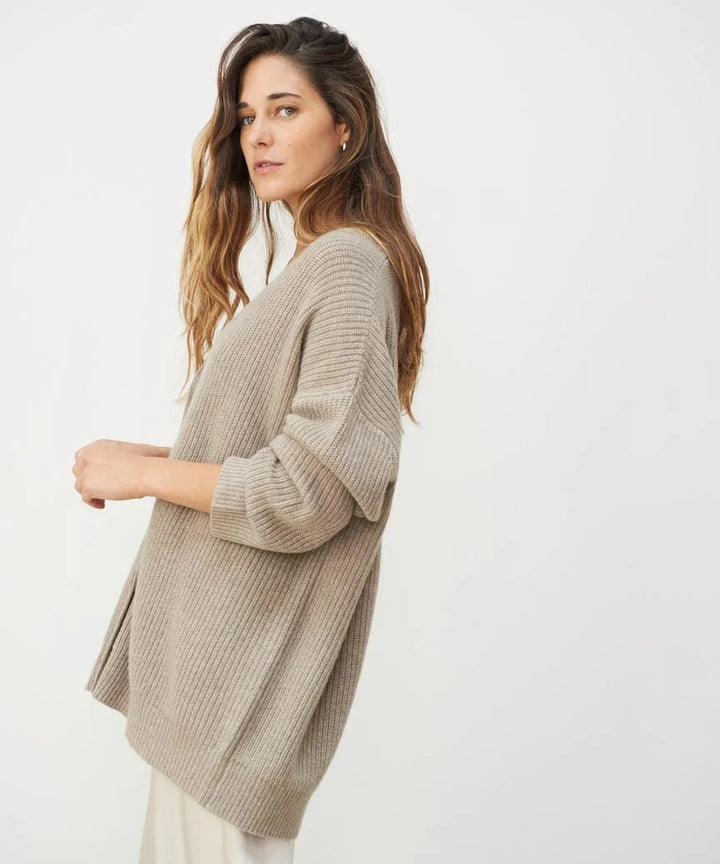Elegant women's cashmere V-neck cardigan; soft, lightweight fabric in chic colors; perfect for layering and adding style.