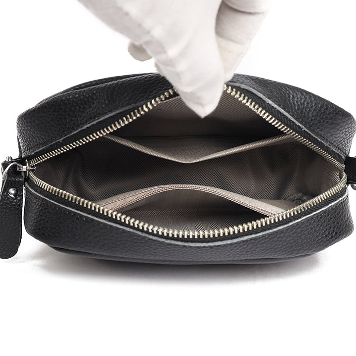 Elegant women's leather crossbody bag with adjustable strap, pebbled texture, ideal for casual or formal occasions.
