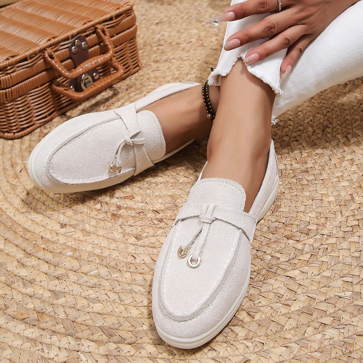 Elegant women's leather loafers in smooth finish, available in various classic and vibrant colors, perfect for all occasions.