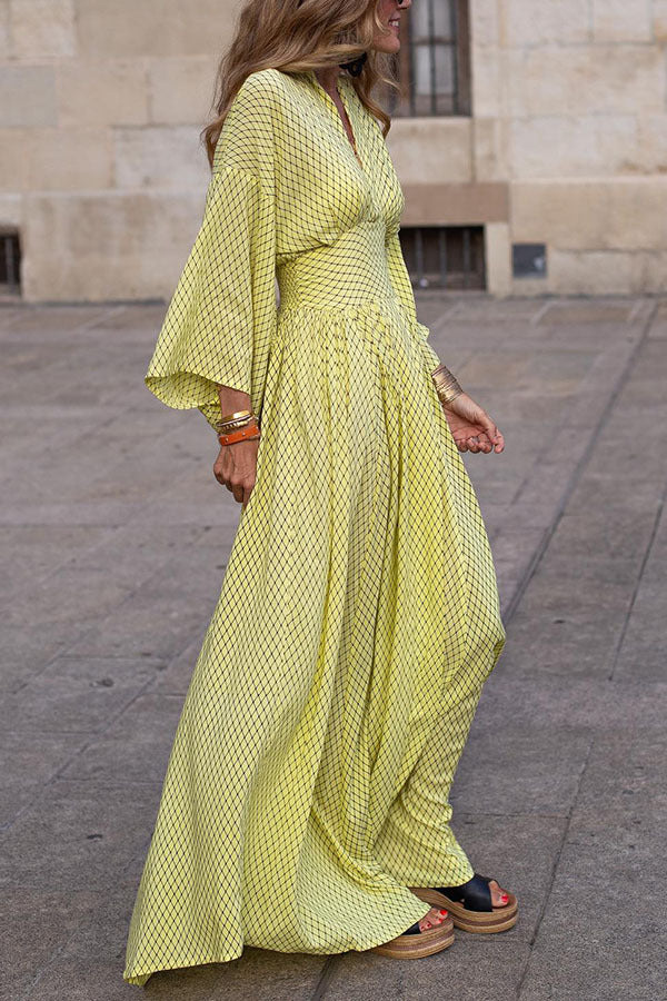 Elegant women's long sleeve V-neck midi dress in front view with defined waist and flowy hem, perfect for any occasion.