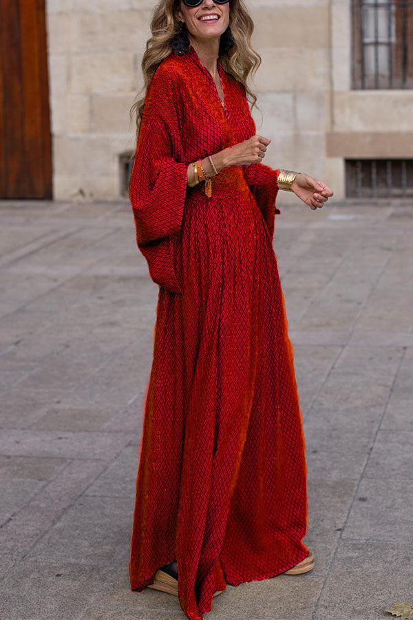 Elegant women's long sleeve V-neck midi dress in front view with defined waist and flowy hem, perfect for any occasion.