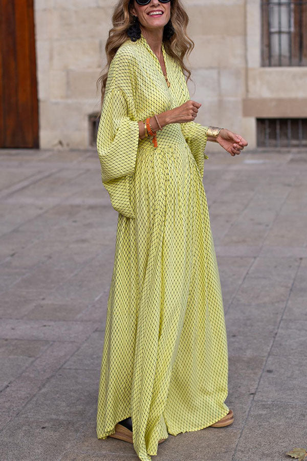 Elegant women's long sleeve V-neck midi dress in front view with defined waist and flowy hem, perfect for any occasion.