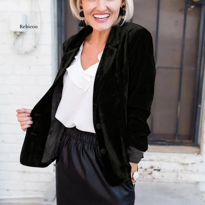 Elegant women's long-sleeved velvet blazer in soft velvet, tailored fit for formal or casual chic outfits.