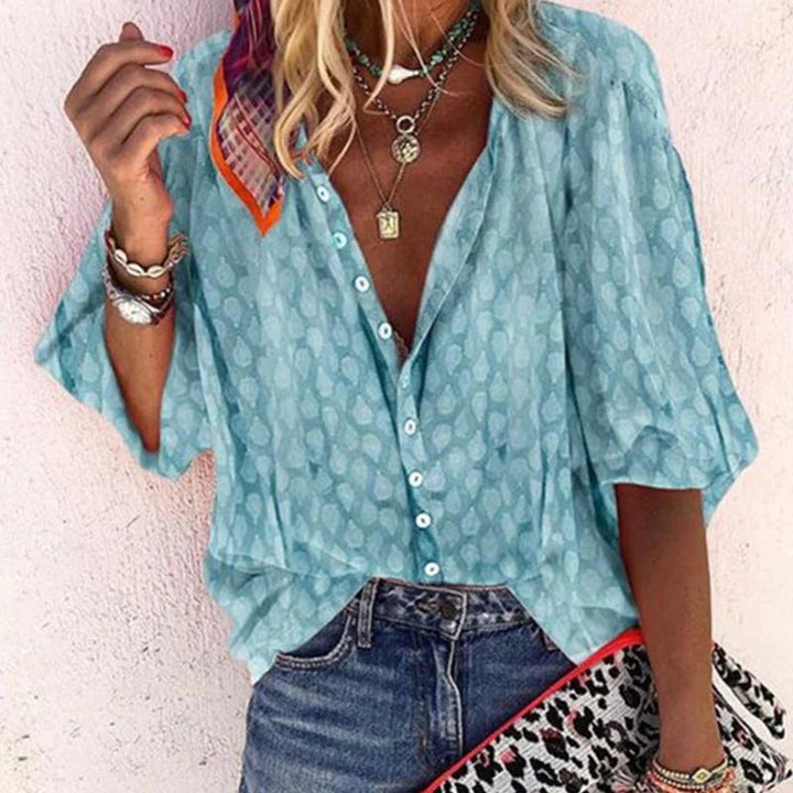 Elegant women's summer blouse with airy fit, versatile design; ideal for chic warm-weather outings and casual gatherings.