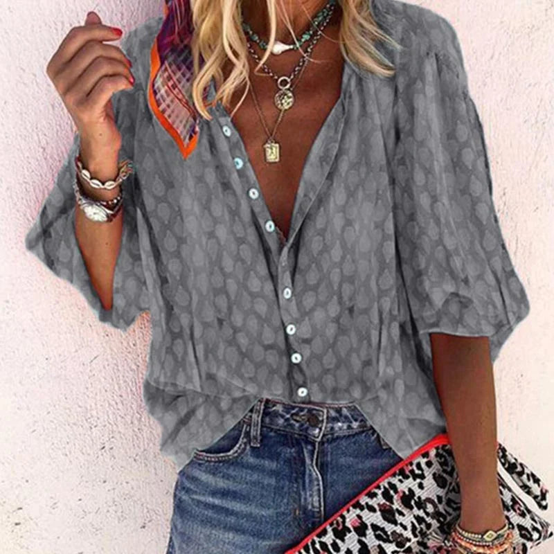 Elegant women's summer blouse with airy fit, versatile design; ideal for chic warm-weather outings and casual gatherings.