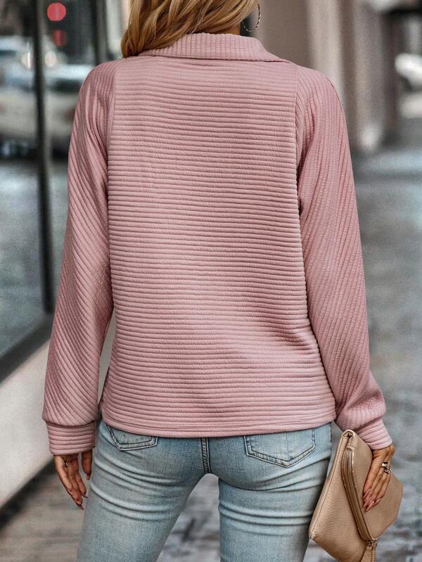 "Elegant women's V-neck jumper with chic half zip, in soft fabric for style and comfort, perfect for any occasion."