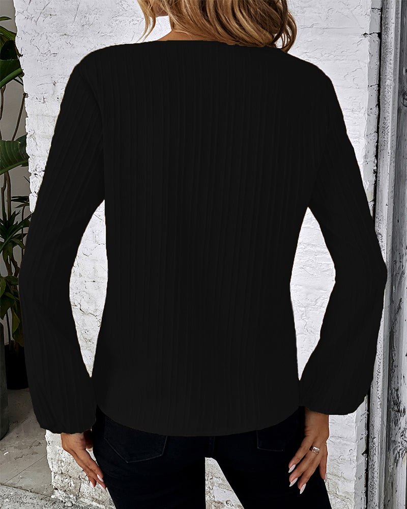 Women's elegant V-neck top with billowy balloon sleeves and a flattering fit, essential for any wardrobe.