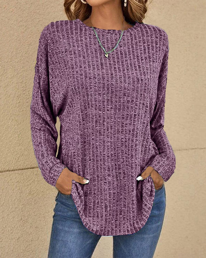 Comfortable women's crew neck long sleeve jumper. Soft, solid color basic top for layering or casual everyday fashion.