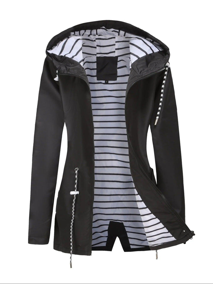 Lightweight women's waterproof jacket. Stay dry & fashionable in this summer rain coat, ideal for unpredictable weather.