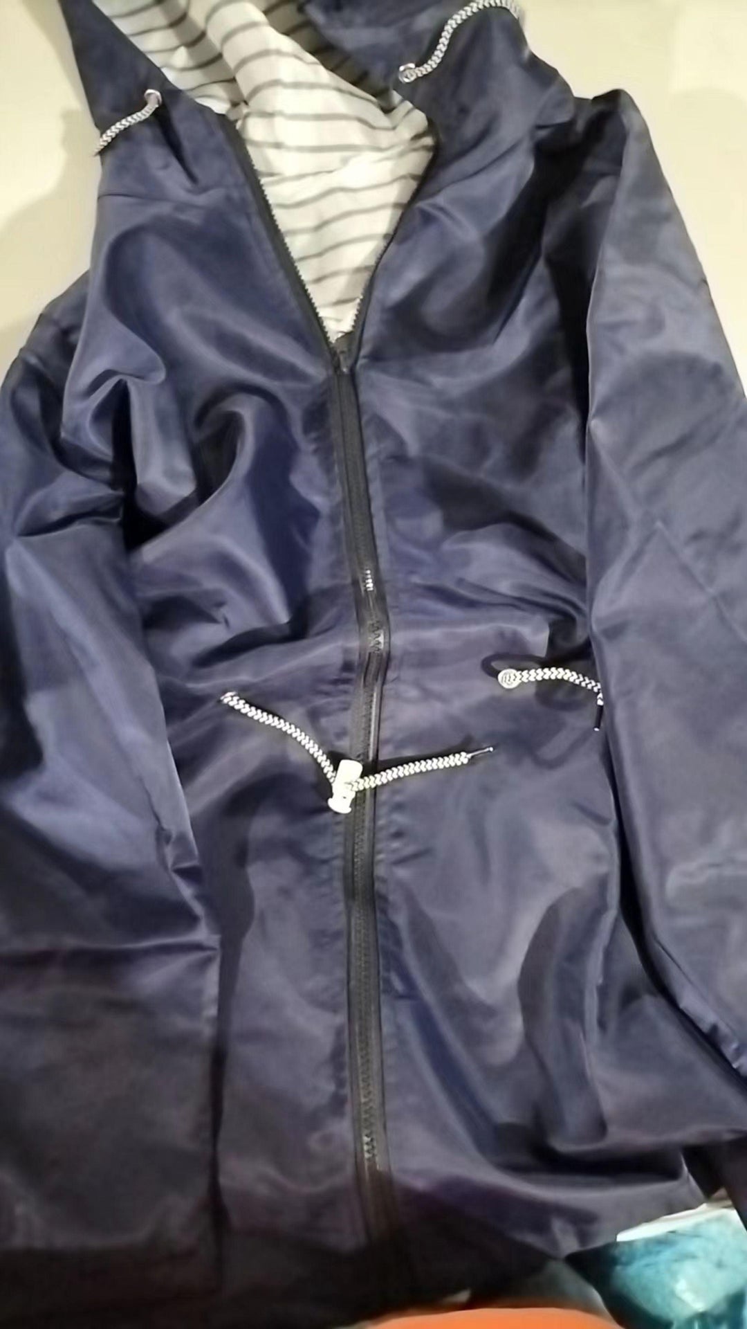Versatile women's summer rain coat. Lightweight, waterproof, and stylish for ultimate protection in warm climates.
