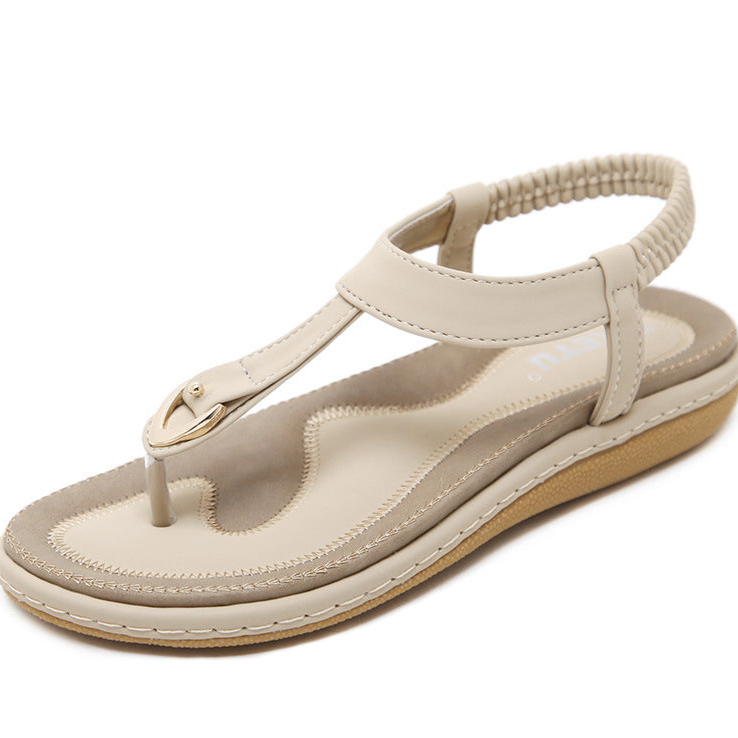 Stylish women's open-toe T-strap flat sandals, perfect for warm weather and everyday comfort.