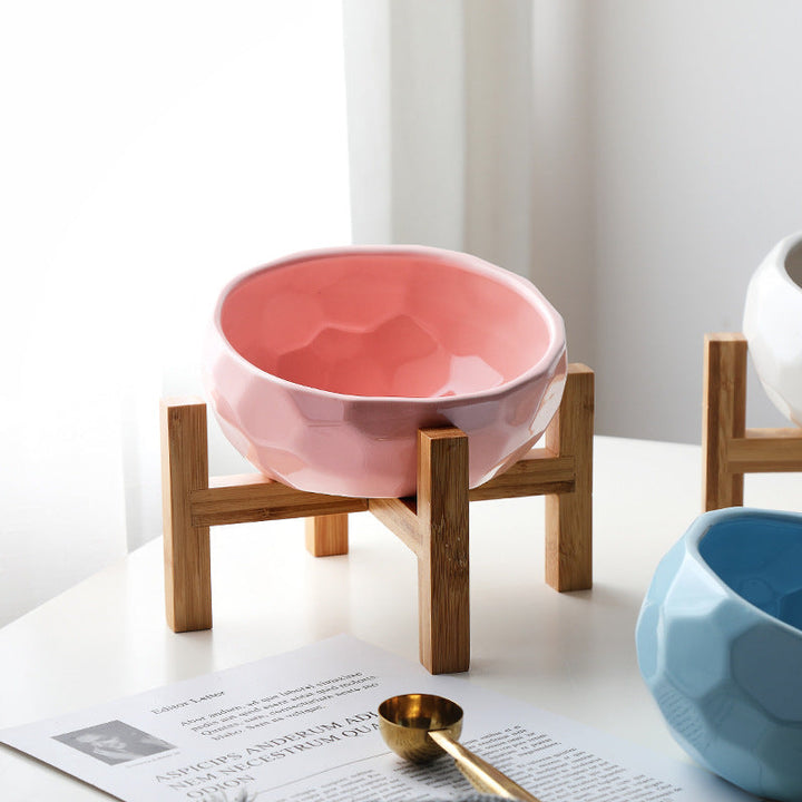 "Ergonomic elevated pet bowl with non-slip wooden stand, sleek design, blue color, enhances pet comfort and posture."