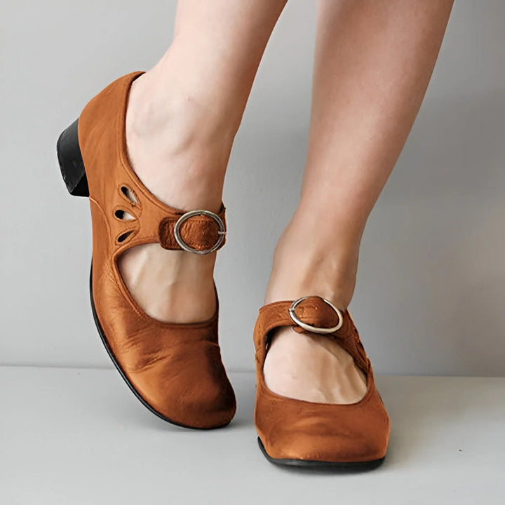Ergonomic women's orthopedic leather sandals with adjustable straps, designed for comfort and natural foot alignment.