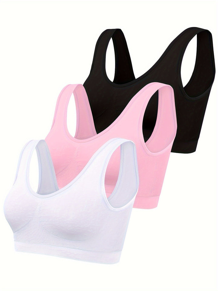 Seamless sports bra and open-back tank top in a comfy 3-piece women's activewear set for gym.