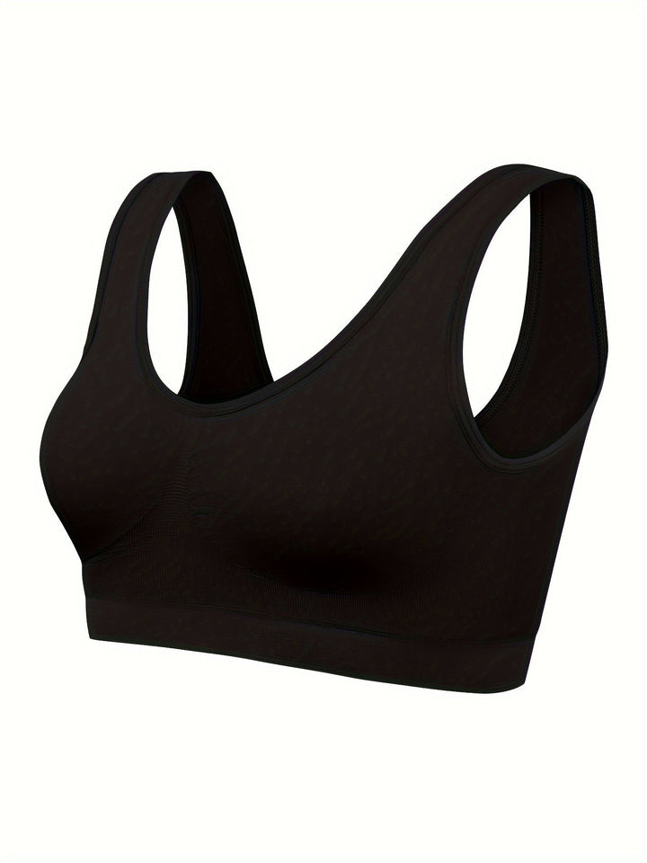 Women's comfortable 3-piece activewear set: seamless sports bra, tank top, and matching apparel.
