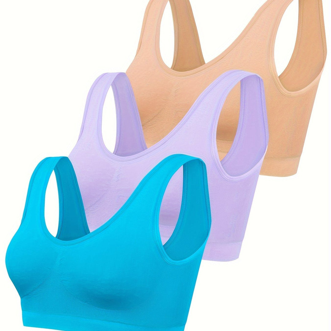 Stylish women's activewear set: open-back tank, seamless sports bra & matching bottoms for gym/yoga.