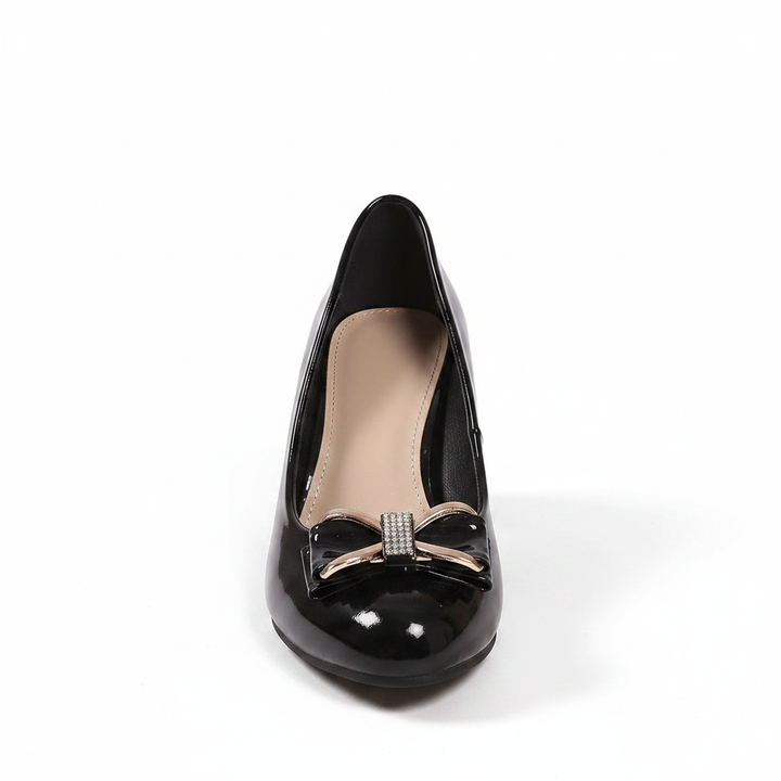 Comfortable women's mid-heel block pumps with stylish bow detail.