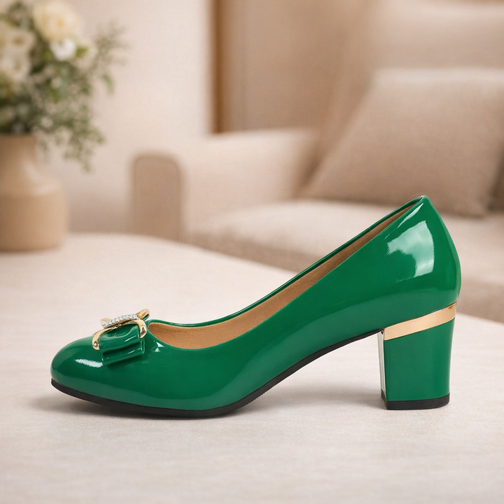 Classic women's mid-heel block pumps with a decorative bow.