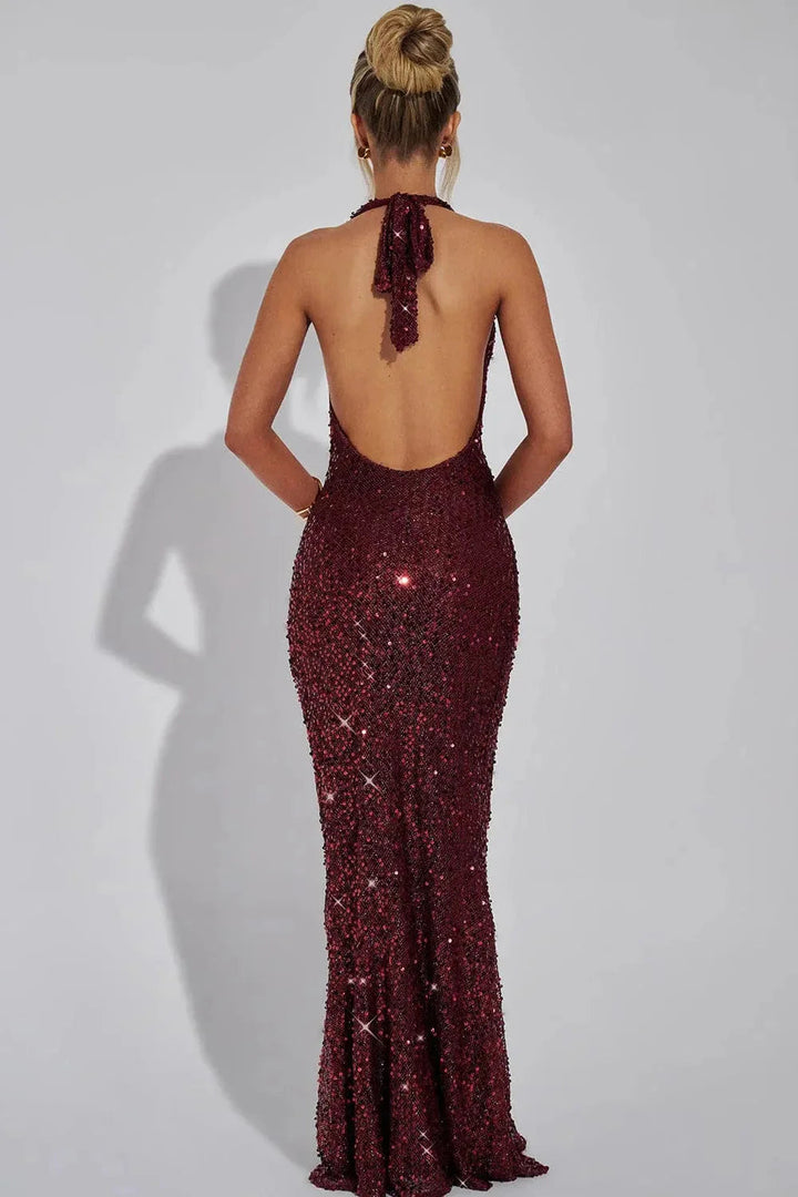 Women's sequin halter formal dress with open back detail. A chic & elegant maxi length.