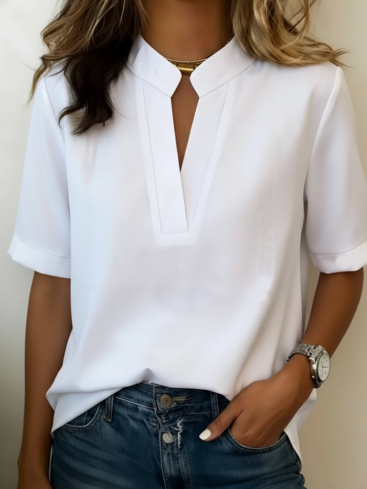 Women's chic V-neck blouse, elegant & versatile. Perfect for workwear or stylish casual outfits.