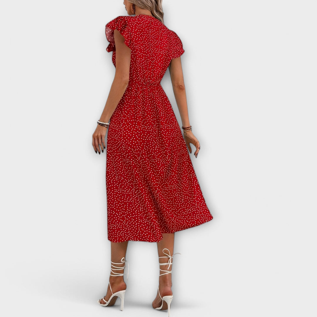 Chic casual A-line polka dot midi dress, offering comfort and style for women's spring activities.