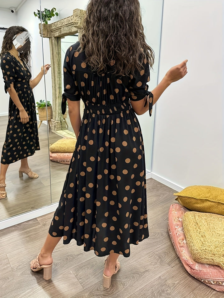 Chic women's black polka dot midi dress, a versatile piece for effortless style and occasion wear.