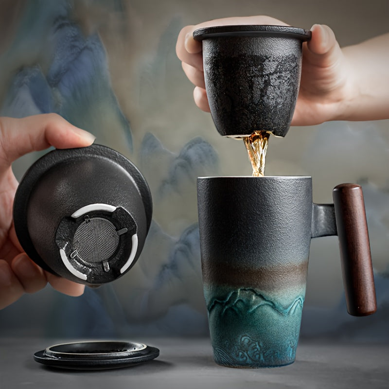 Handcrafted ceramic tea mug with strainer for loose leaf tea; artistic design, comfortable handle.