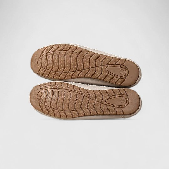 Sophisticated women's slip-on flat sandals, closed-toe design for elegant everyday comfort.
