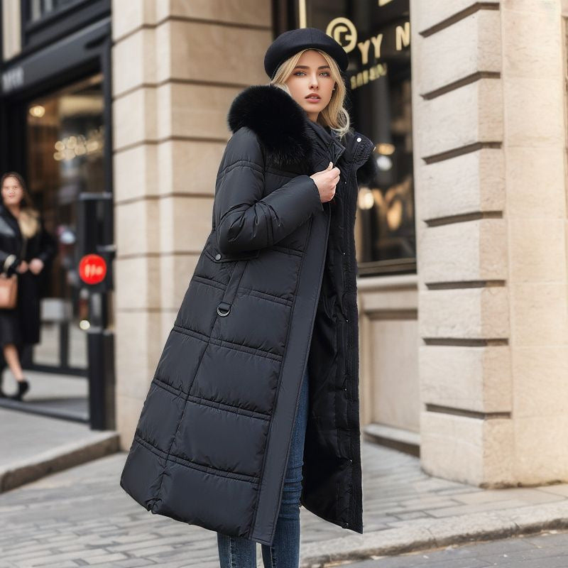 Warm women's elegant winter coat for fall fashion. Features a tailored fit and removable hood.