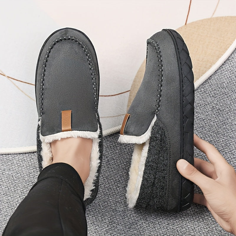 Close-up of the soft sheepskin lining inside men's warm, cozy house slippers with non-slip sole.