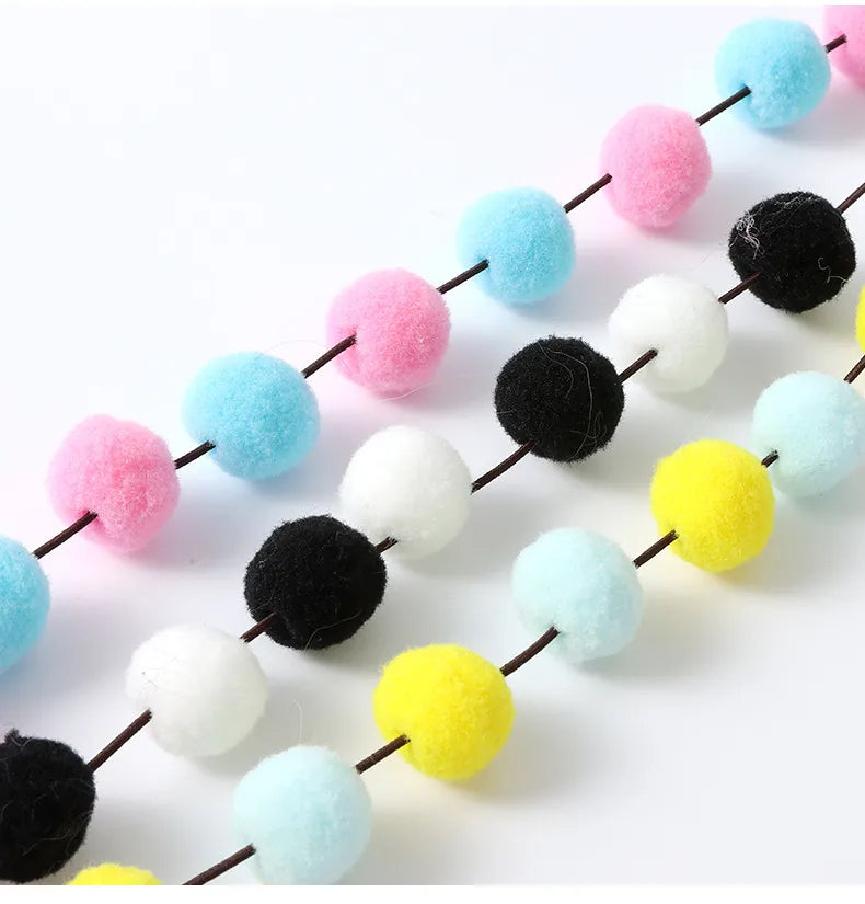 Durable cat wand toy with interchangeable feather & pompom attachments, designed for playful felines & kittens.