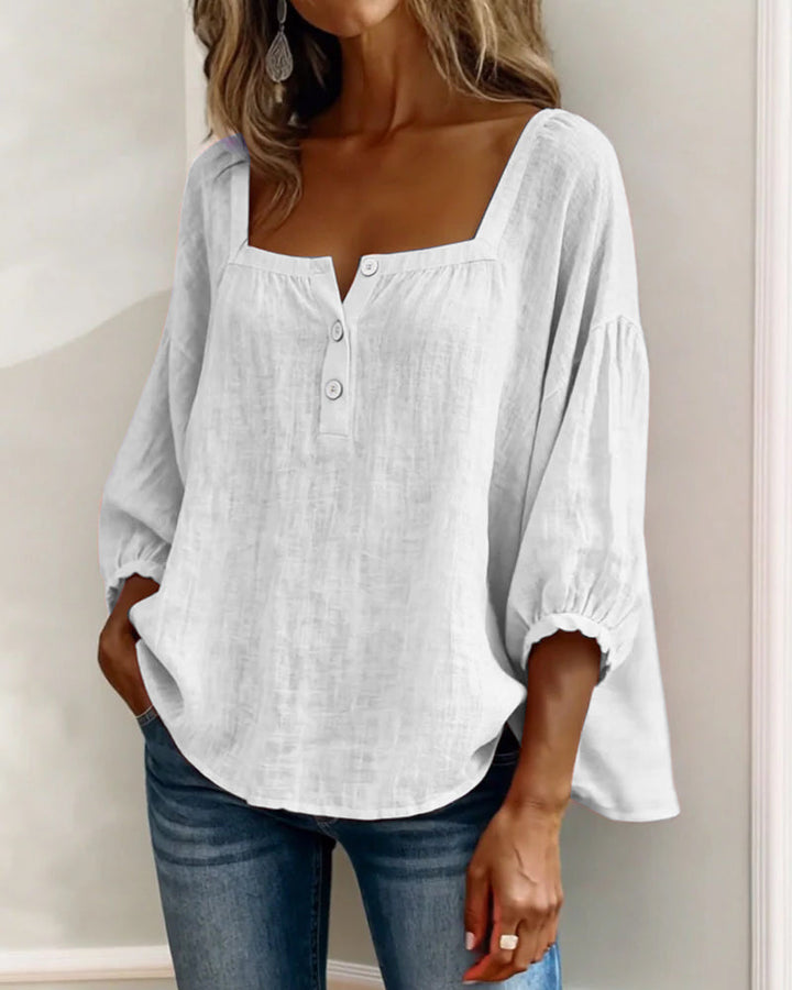 Spring/summer women's blouse, relaxed fit, stylish puff sleeves, square neckline.