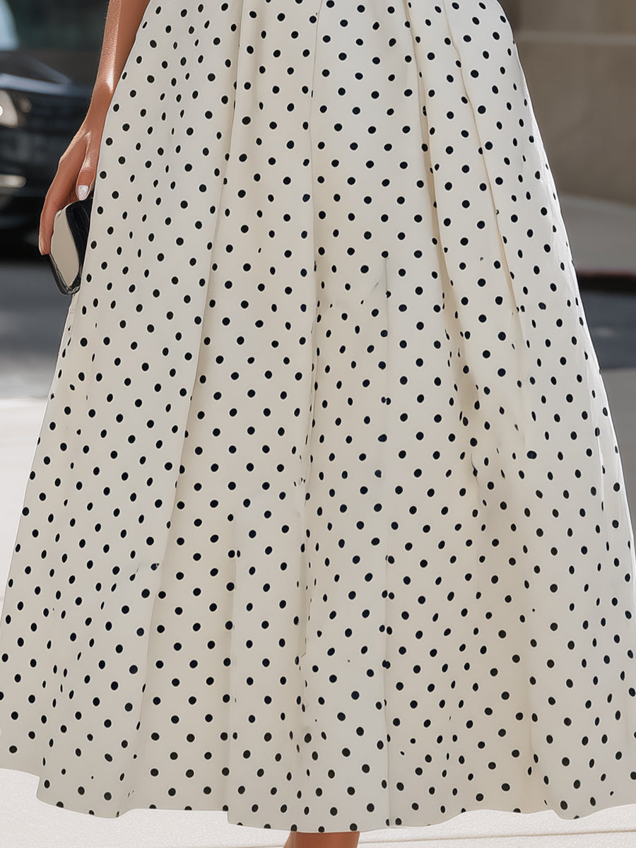 Sleeveless white polka dot A-line midi dress for women, flattering fit, perfect summer party wear.