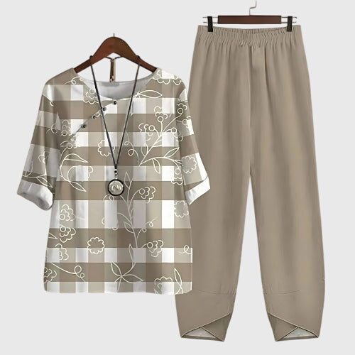 Fashionable women's two-piece jogger set with a relaxed fit, ideal for casual wear & summer.