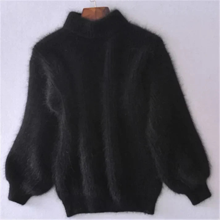 Close-up of a soft knit women's vintage-inspired pullover sweater, highlighting texture and quality.