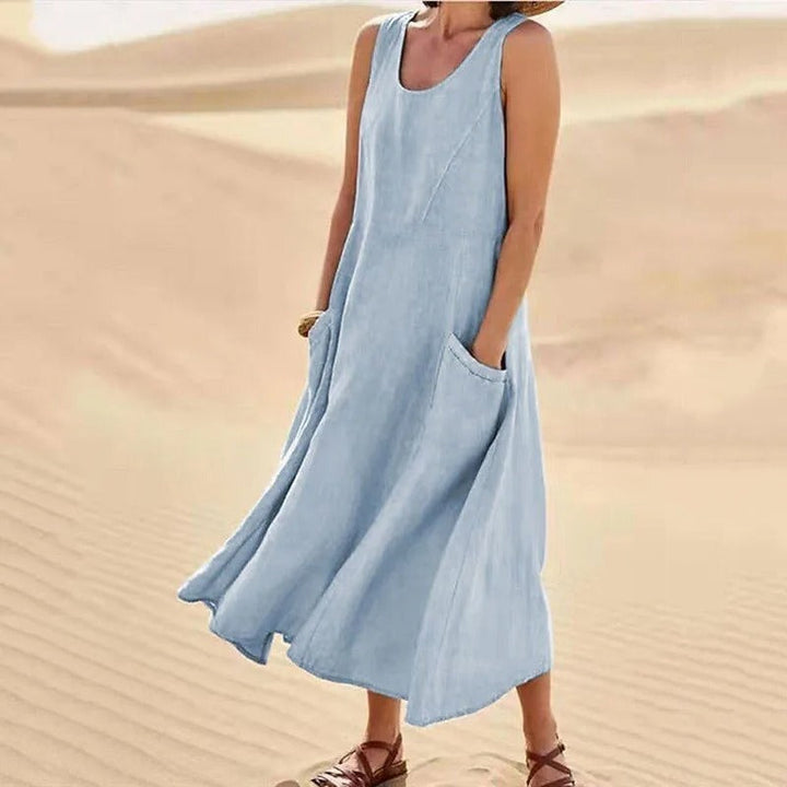 Elegant yet casual women's sleeveless dress with pockets; versatile for various occasions.