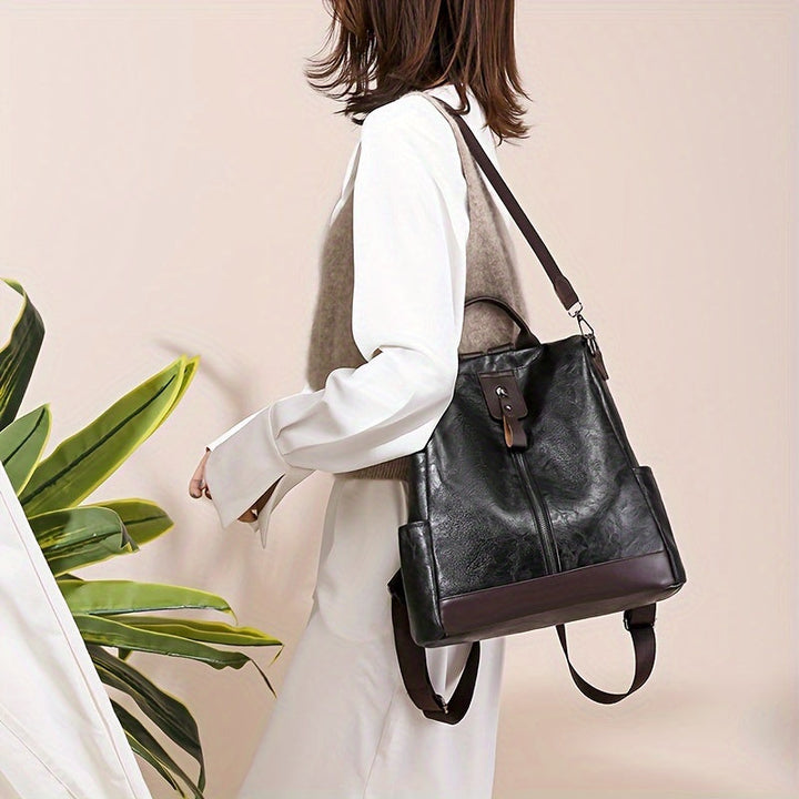 Green women's everyday anti-theft backpack. Ideal commuter bag for urban fashion and secure daily carry.
