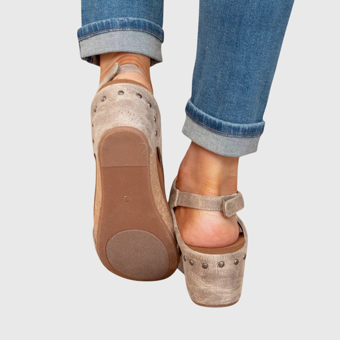 Stylish women's open toe sandals with a comfortable wedge heel, perfect for casual summer wear.