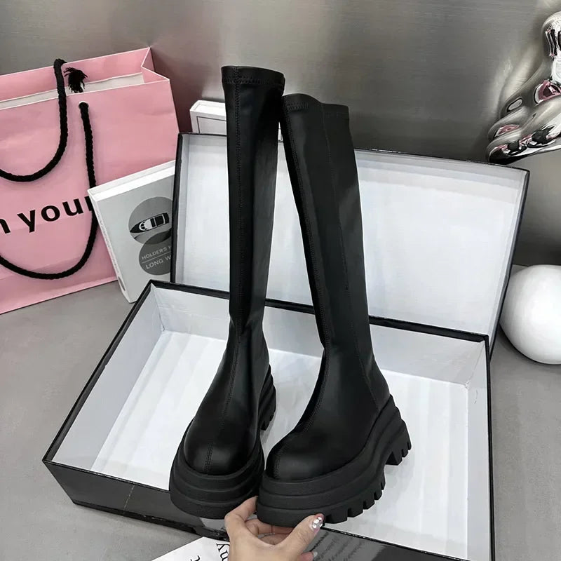 Stylish women's long black boots for daily wear. Comfortable, elegant tall winter footwear, perfect for fashion.