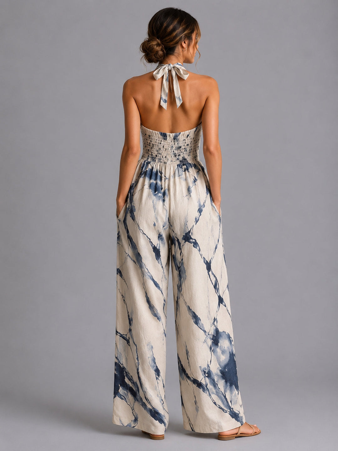 Chic women's wide-leg halter jumpsuit for effortless style. Lightweight and comfortable for spring/summer.