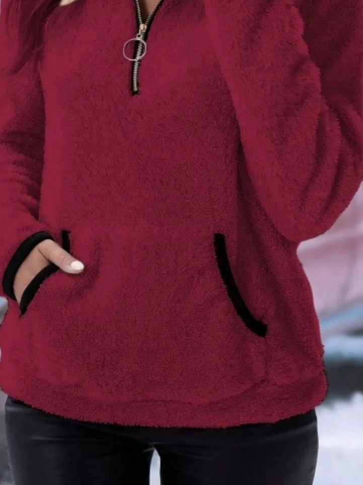 Cozy women's long sleeve half-zip sweater, ideal for winter style.