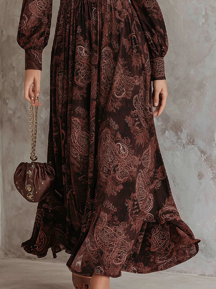 Stylish women's long-sleeve midi dress showcasing a vibrant paisley pattern & chic zip-neck design.
