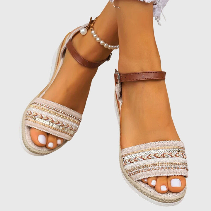 Casual women's summer sandals. Brown & white orthopedic flat footwear with arch support & adjustable straps.