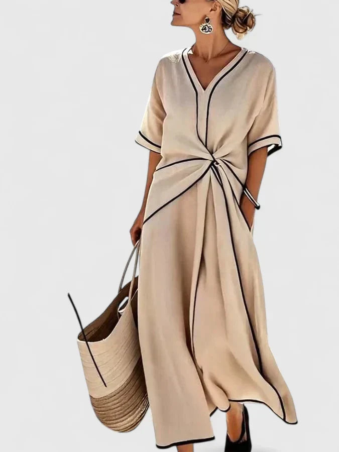 Elegant women's striped summer maxi dress. Comfortable, flowy design perfect for versatile everyday casual fashion.