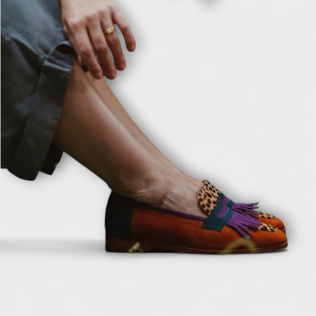 Chic women's brown slip-on loafers with a polished finish, offering versatile style and all-day comfort.